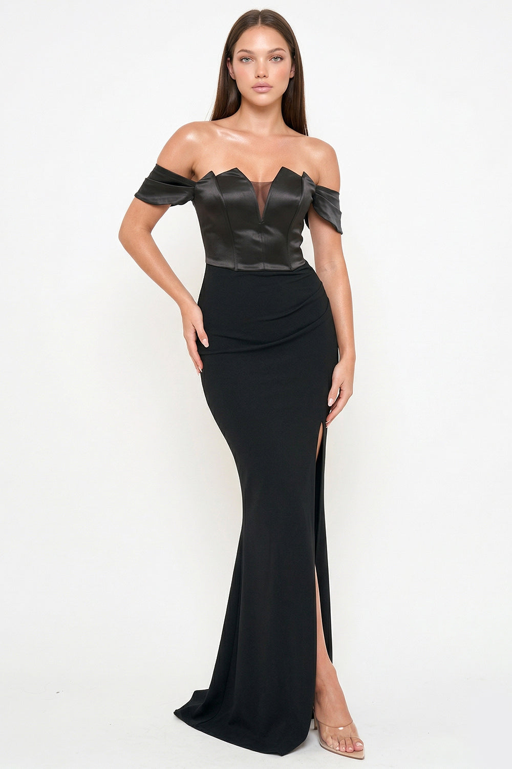 Model wears a black off-shoulder formal gown with a satin sweetheart bodice and a side-slit floor-length skirt.