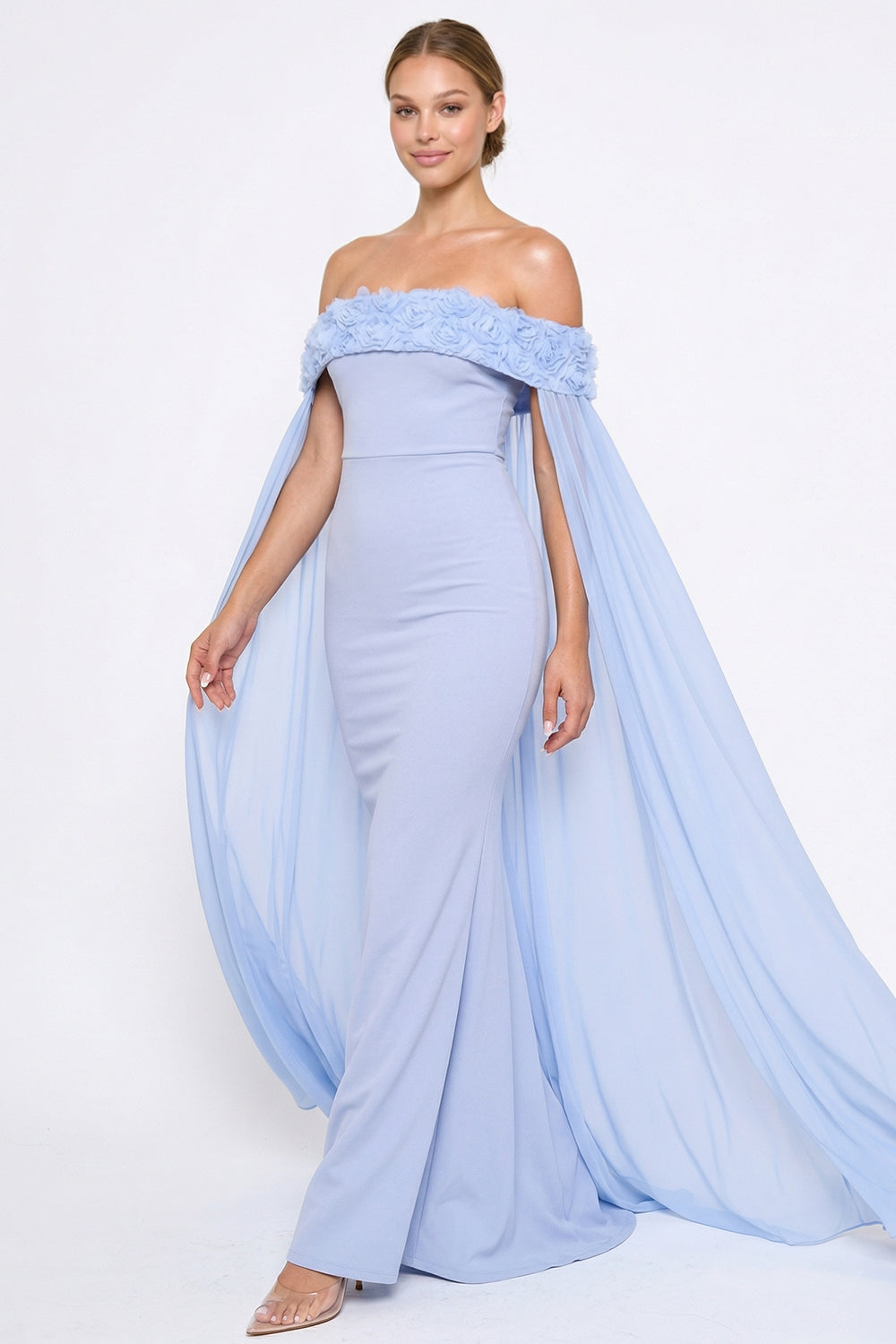 Boutinie pale blue off-shoulder evening gown with floral neckline detail and flowing chiffon cape sleeves.