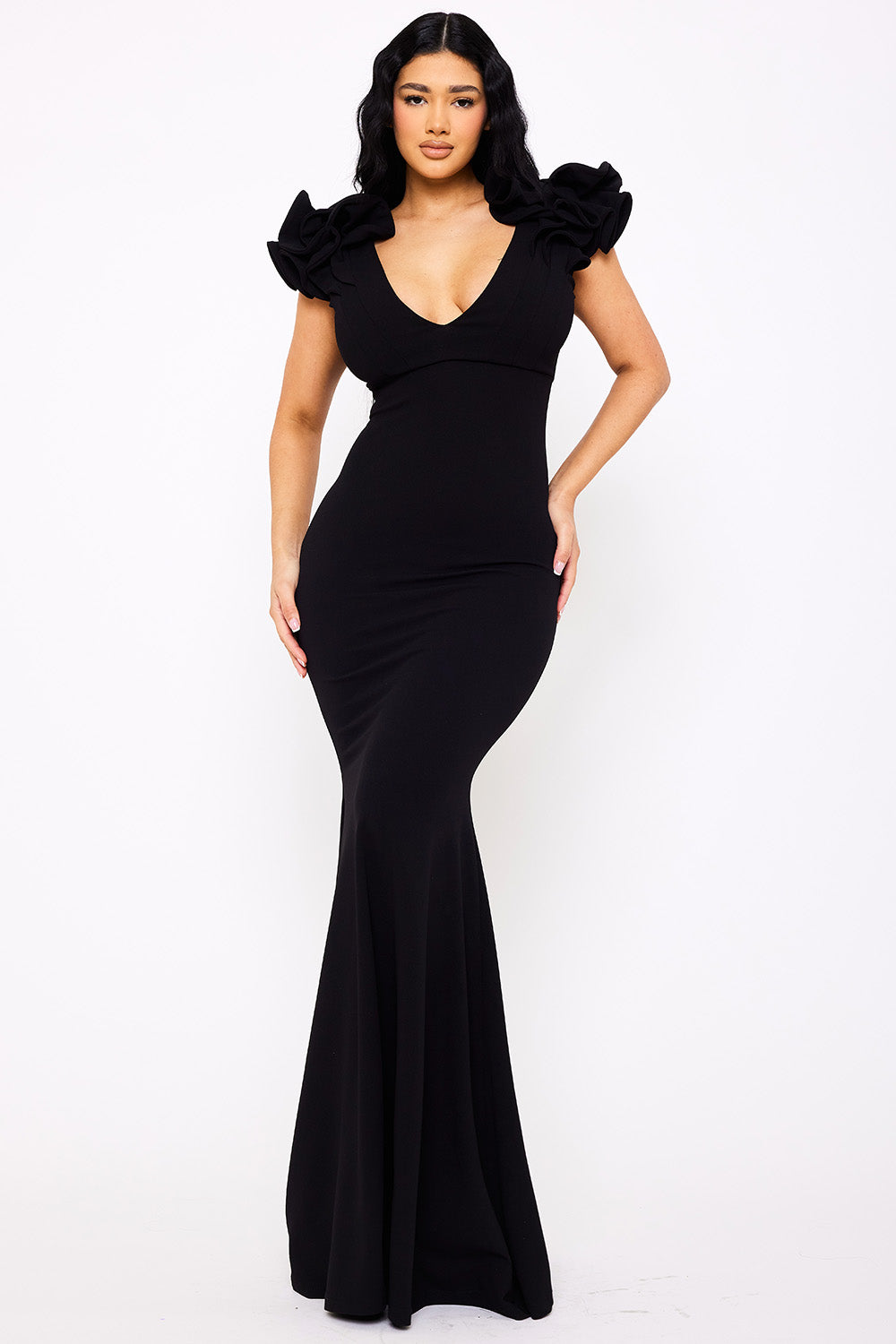 Black formal gown with V-neckline, mermaid silhouette, and dramatic ruffled cap sleeves by Boutinie.