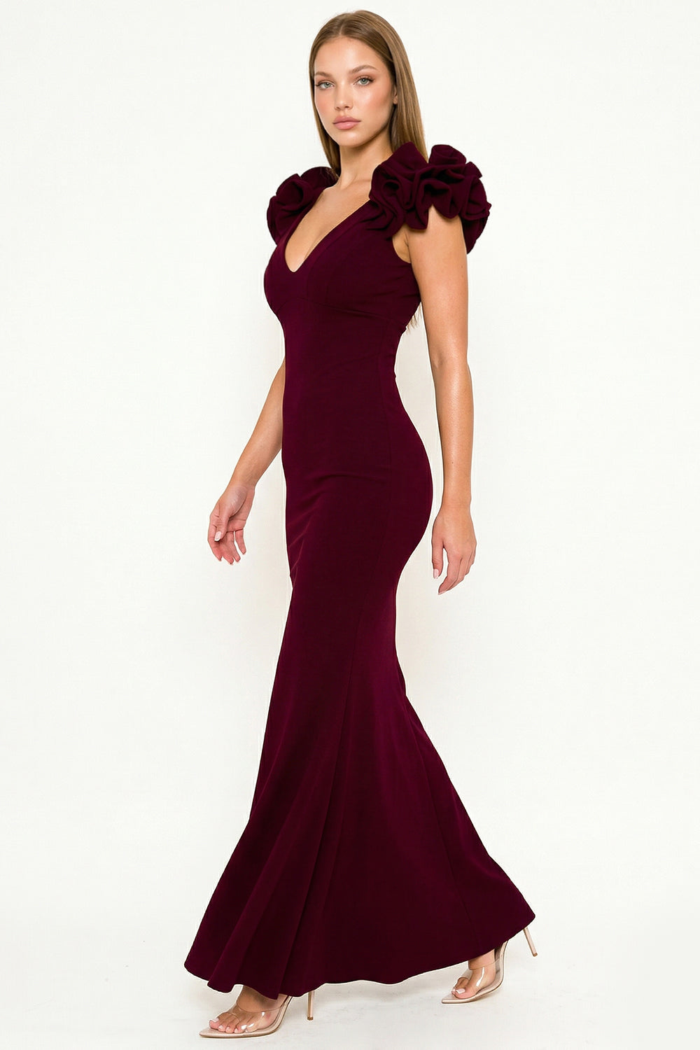 Burgundy mermaid gown with deep V-neck, ruffle sleeves, and form-fitting silhouette for a formal evening event.