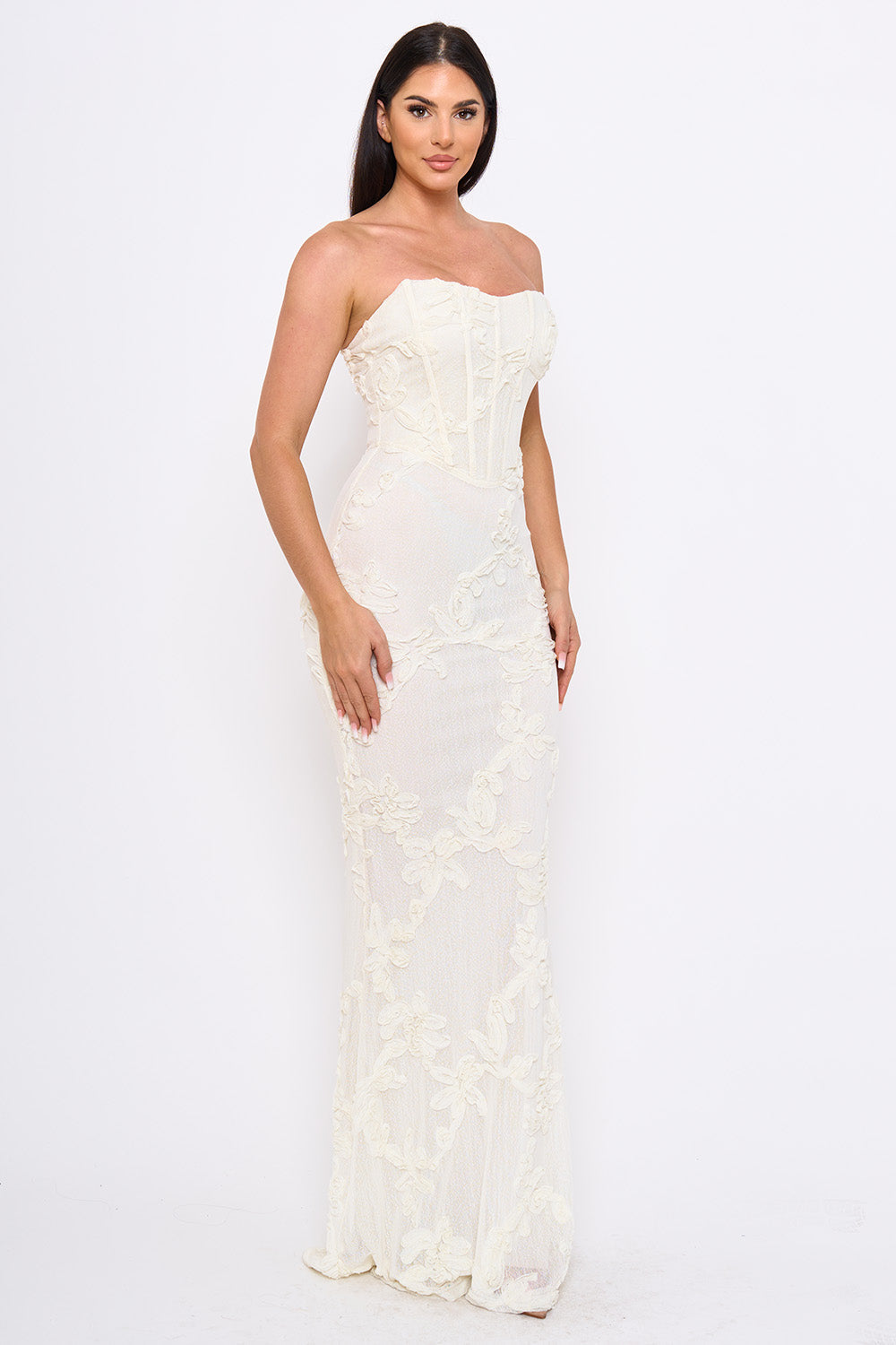 Ivory strapless corset gown with floral lace appliqué, perfect for a wedding or formal evening event.