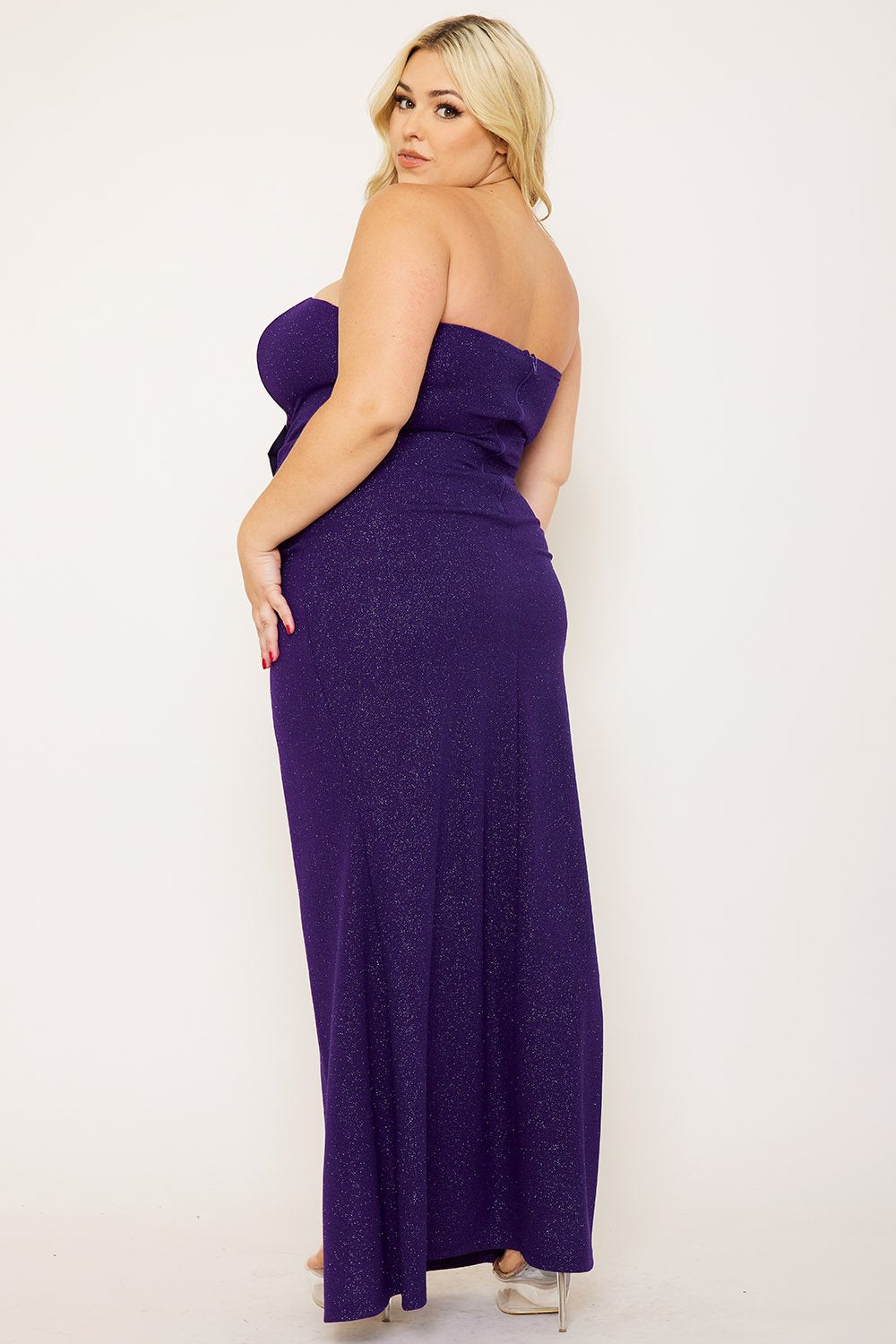 Boutinie purple strapless glitter evening gown with silver bow accents and a high leg slit for formal occasions.